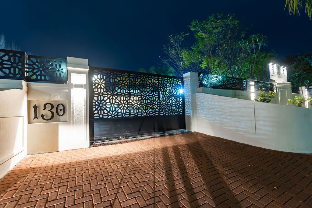 Laser-cut number 130 entrance gate at The Victoria, Newcastle, at night